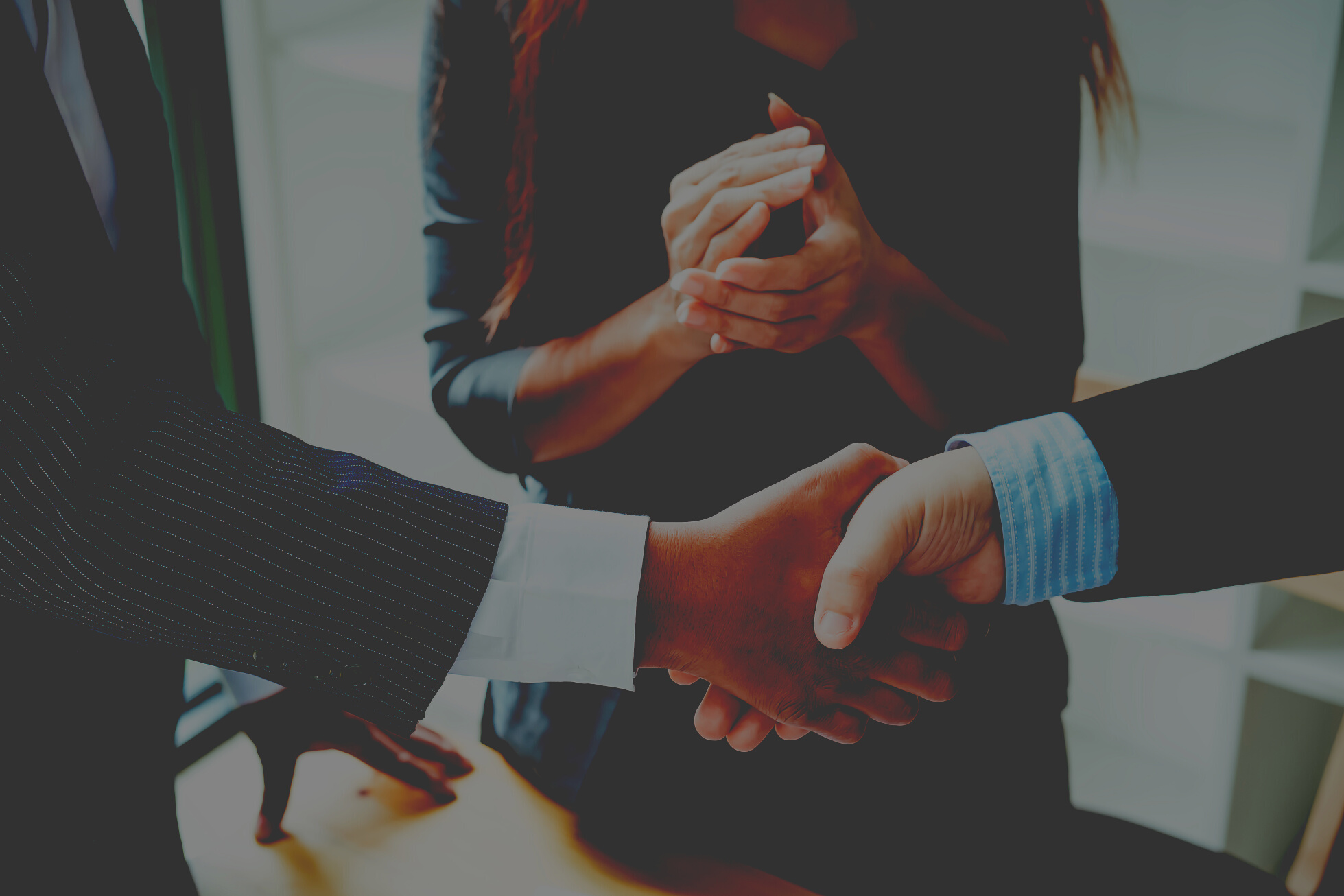 Handshake Between Business People in an Office